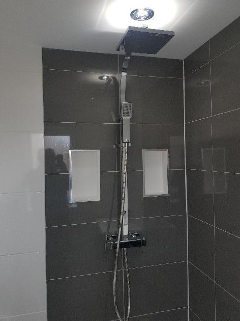 shower cubical with built in shelves