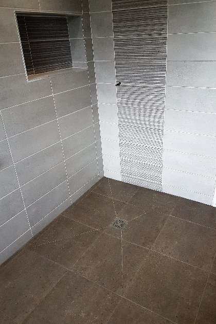 wet room with full tiles in wet area