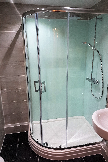 shower cubical with aqua panels installed